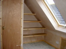 Built in shelving in attic alcoves